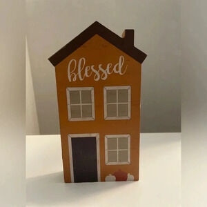 Celebrate wood decor of blessed orange house